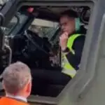 &ldquo;Finland President Alexander Stubb testing Sisu GTP 4x4 armored vehicle during military readiness demonstration&rdquo;