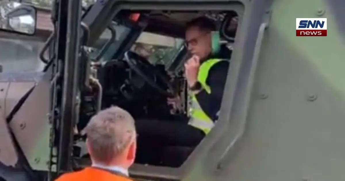 “Finland President Alexander Stubb testing Sisu GTP 4x4 armored vehicle during military readiness demonstration”