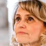 P&auml;ivi R&auml;s&auml;nen speaking at a public event in Finland, symbolizing free speech and religious expression.