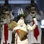 Finland Lucia 2024 Daniela Owusu during candle-lit Lucia Day ceremony in Finland representing festival of light tradition.