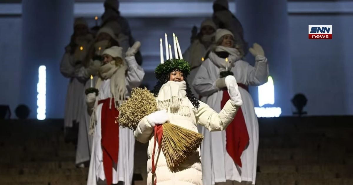 Finland Lucia 2024 Daniela Owusu during candle-lit Lucia Day ceremony in Finland representing festival of light tradition.