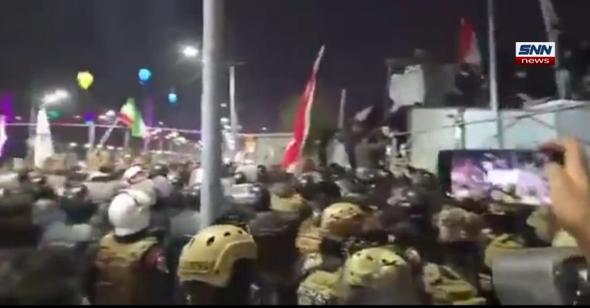 Islamic protesters inside Kuwaiti consulate in Basra removing national flag during unrest