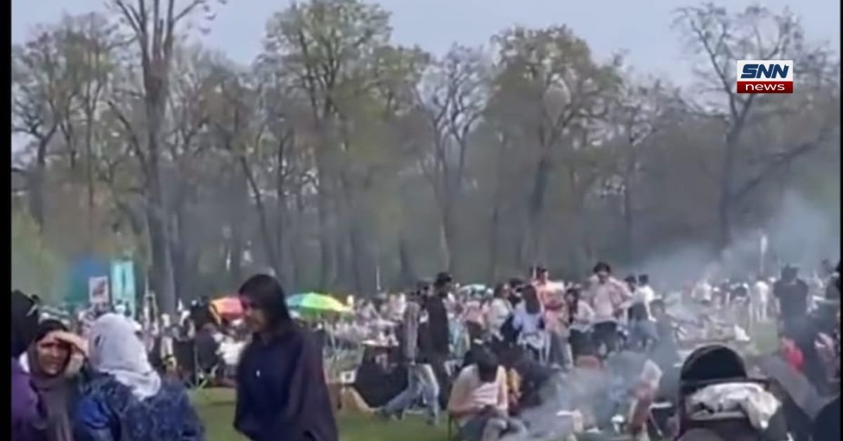 People enjoying warm summer weather in a Berlin park as temperatures reach 27°C in Germany.
