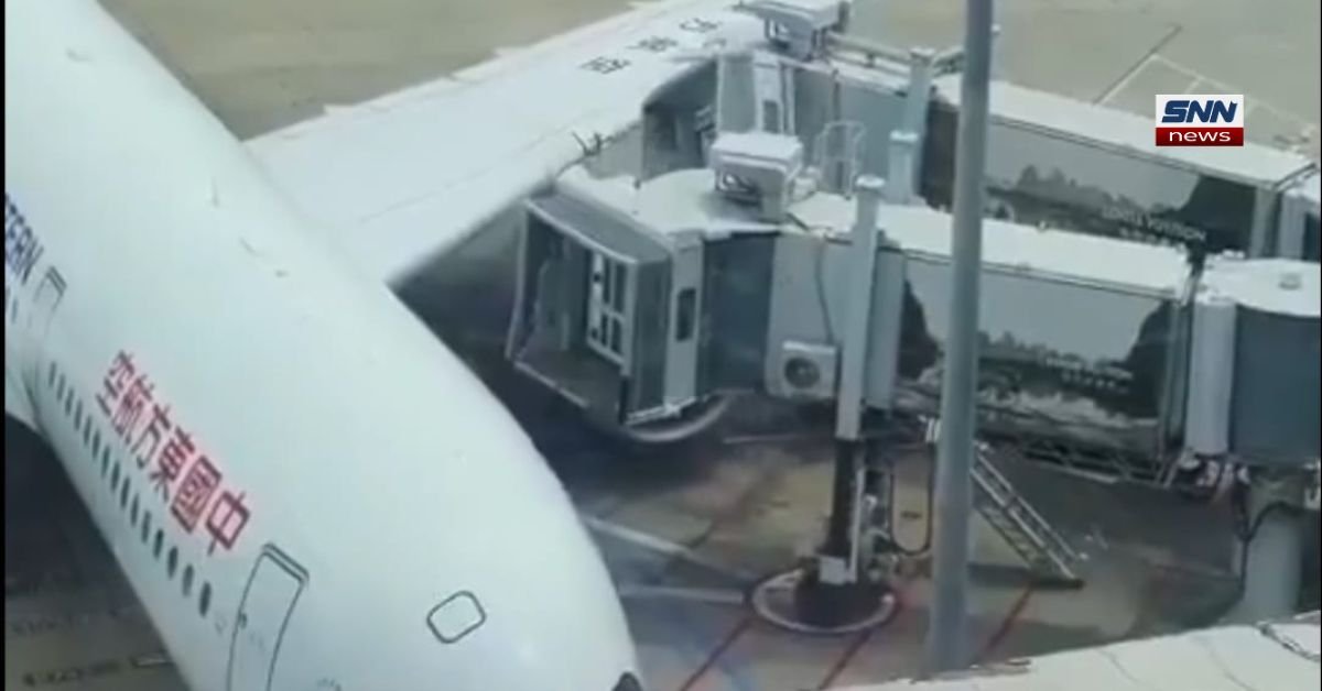 Aircraft wing collides with a jet bridge during landing operations at Shanghai Airport, causing ground safety checks.
