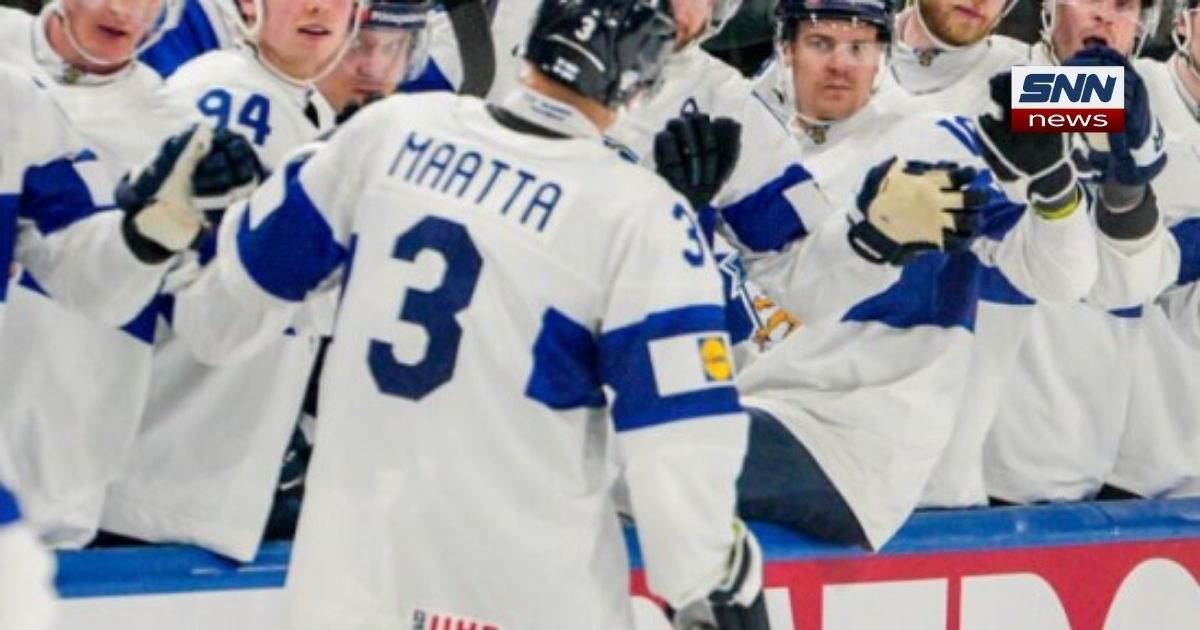 Finland players celebrate after defeating Switzerland 1-0 in the 2026 Ice Hockey World Championship final and lifting the trophy.