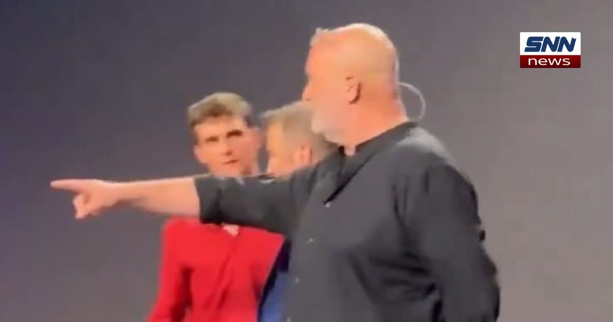 "Demonstrators raise a 'No Tech for Apartheid' banner as Amazon CTO Werner Vogels speaks at the Geneva AI summit."