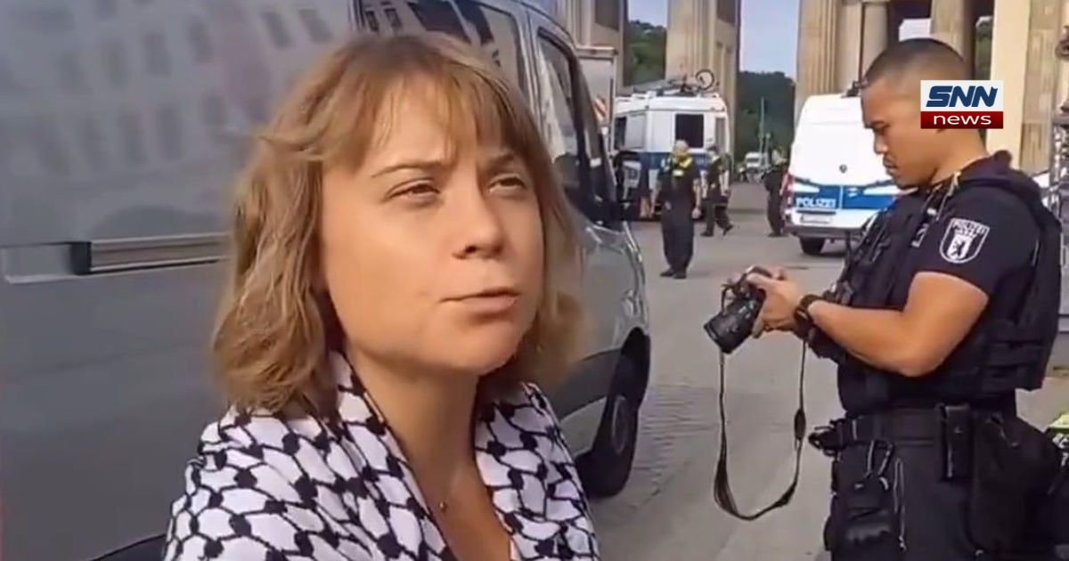 Greta Thunberg glued to ground outside Rheinmetall office in Berlin protest