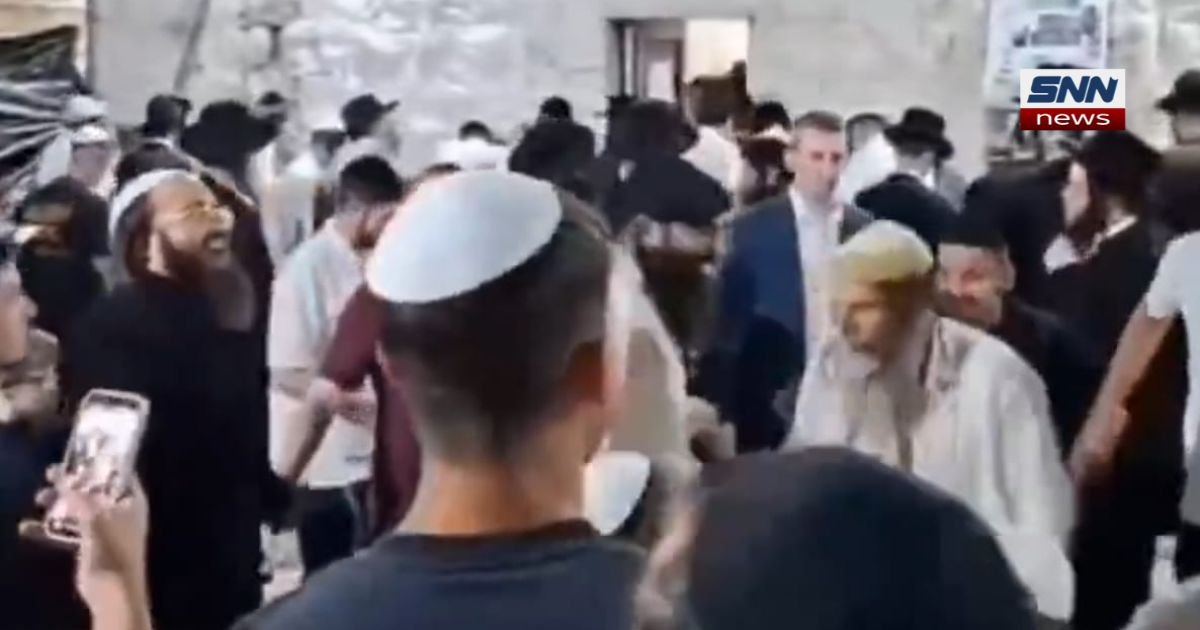 Israeli settlers gathered on a street near Nablus in the occupied West Bank"