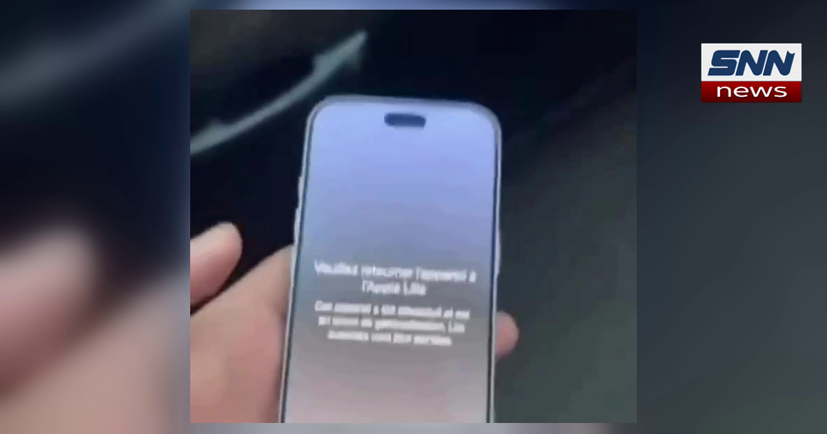 A hand holding an iPhone showing a French Apple Lost Mode message telling the holder to return the device to an Apple Store, SNN News Finland