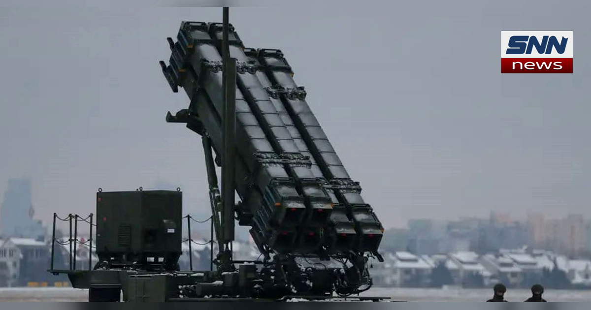 A Patriot missile launcher with four upright canisters deployed in a snow-covered field, SNN News Finland