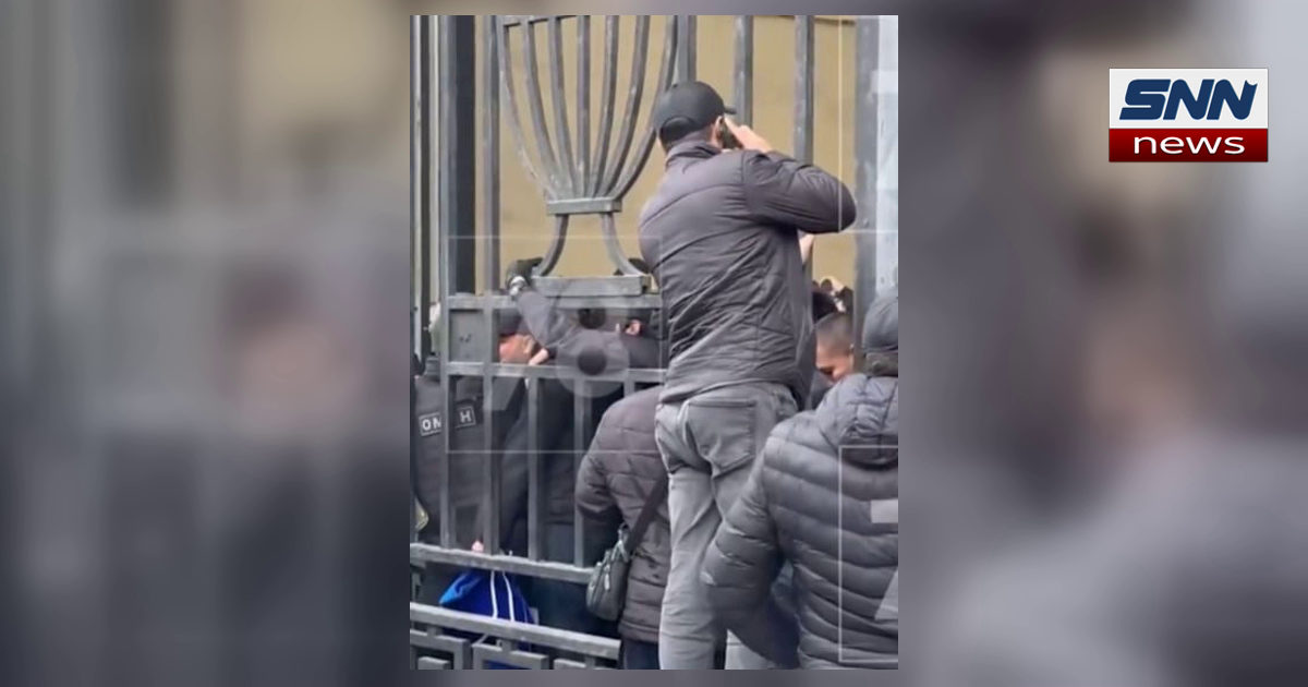 OMON riot police at a cordoned gate during the St Petersburg migrant raid